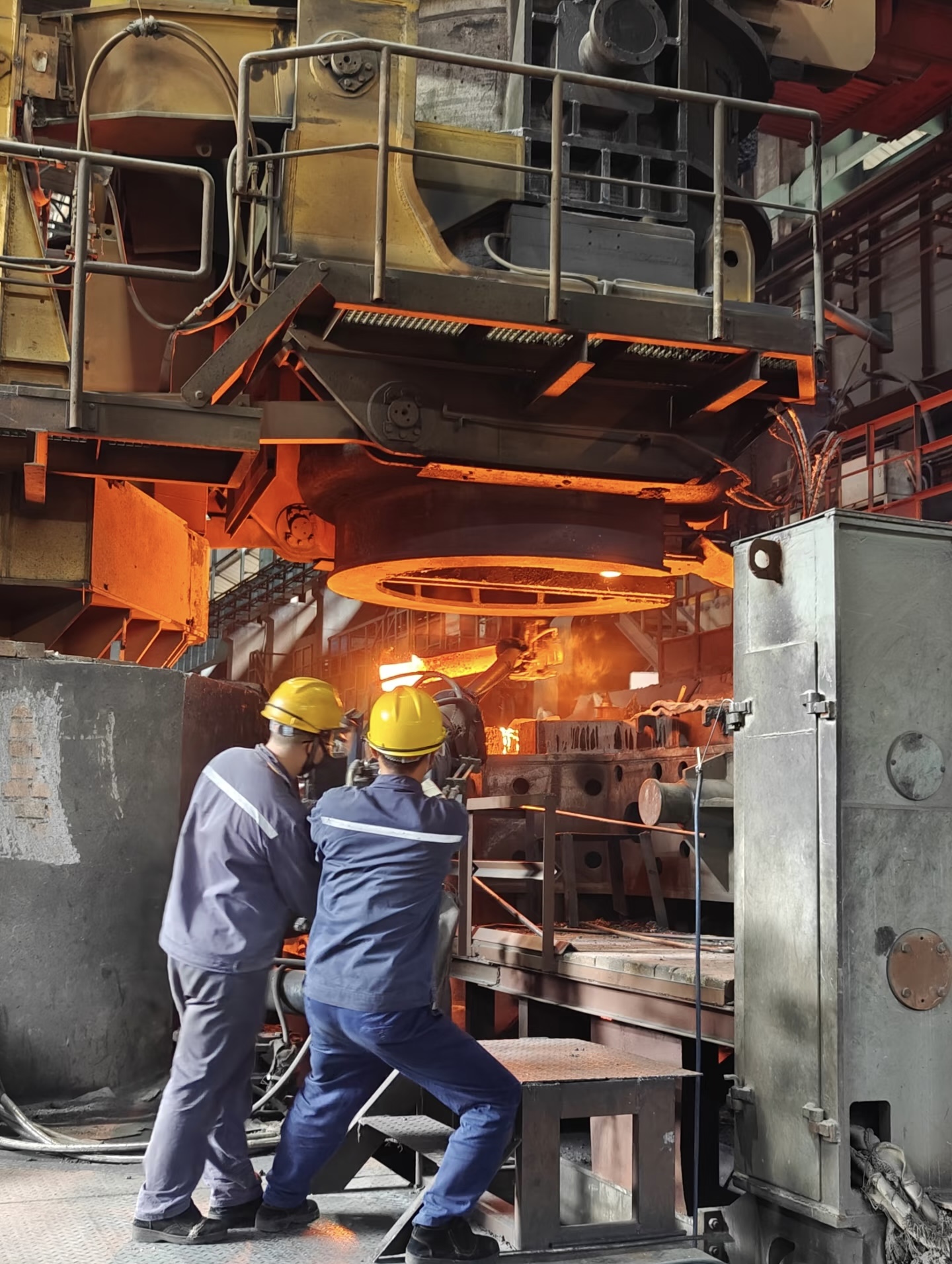 HaiHong Steel factory staff working on steel production line ensuring high quality